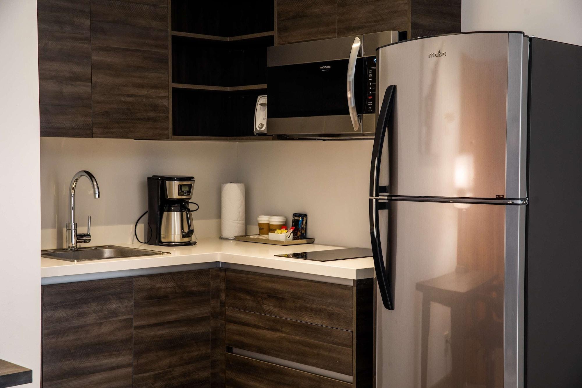 Готель Wyndham Garden Guatemala City Екстер'єр фото A modern kitchen with a refrigerator